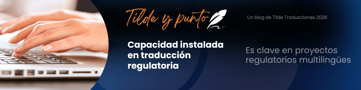 Banner for the Tilde y punto blog showing hands typing on a laptop; headline reads "Capacidad instalada en traducción regulatoria" on a dark blue gradient background with logo on top left.